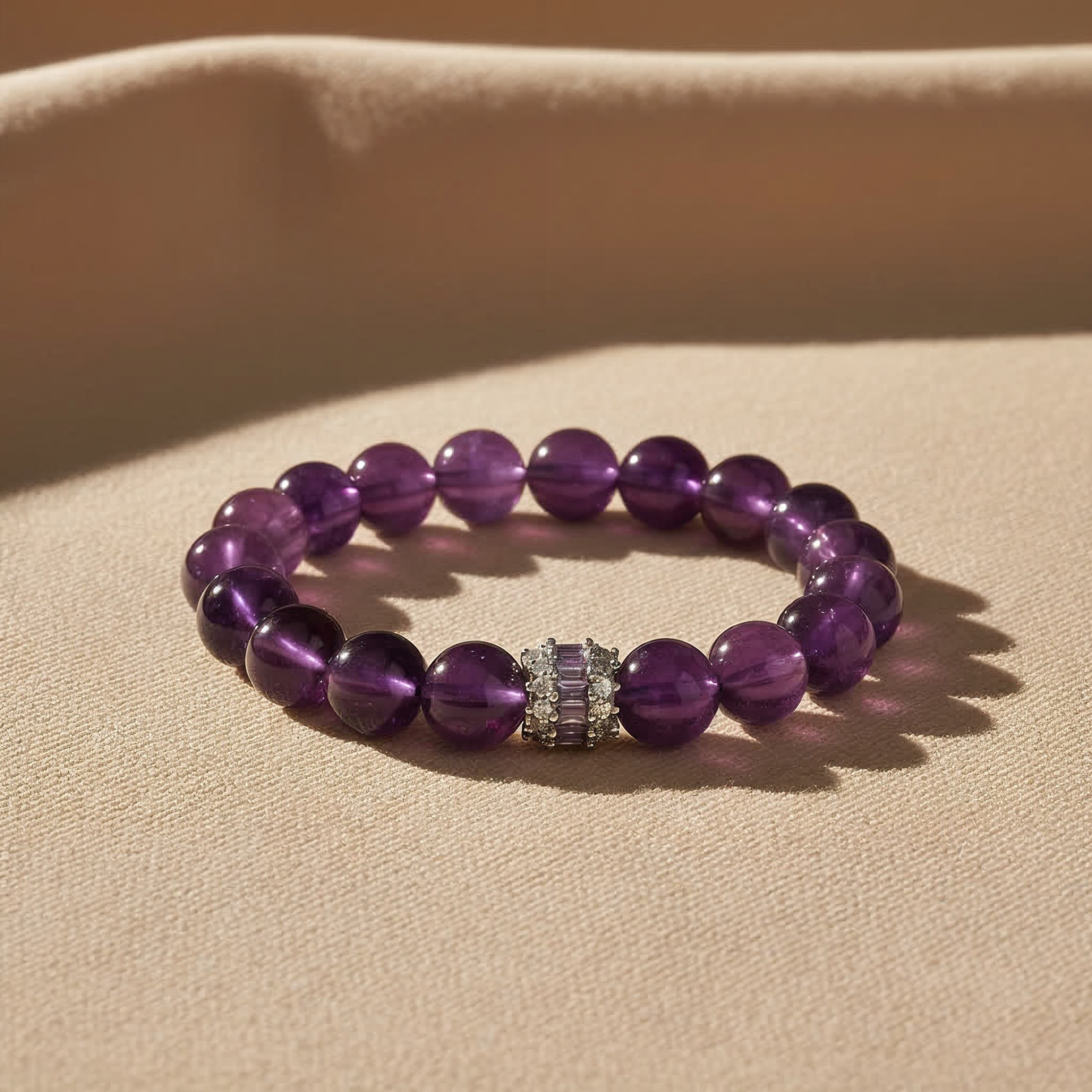 JWPatronus Royal Amethyst Bracelet on fabric surface – luxury crystal photography