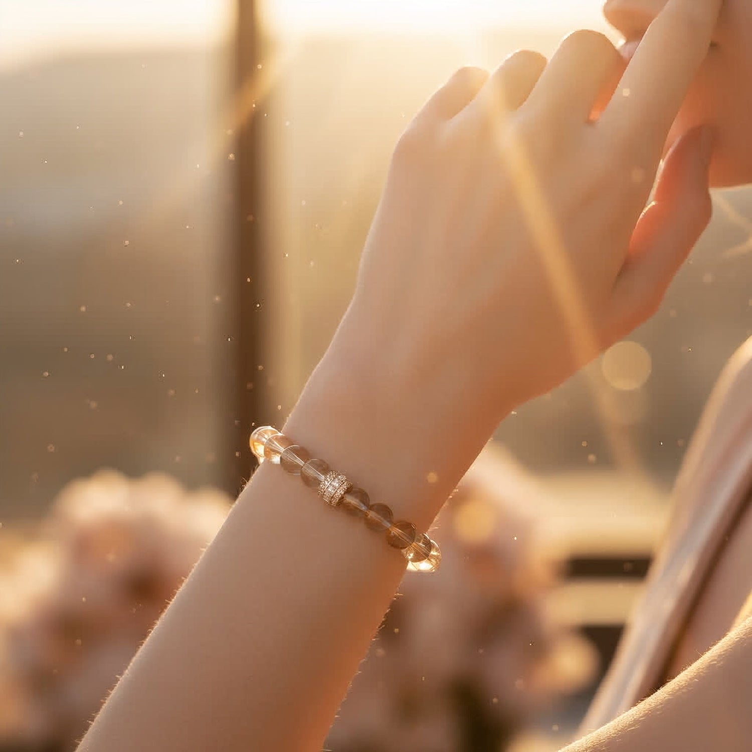 Hand holding natural citrine crystal in front of mountains — symbol of abundance, joy, and energy | JWPatronus