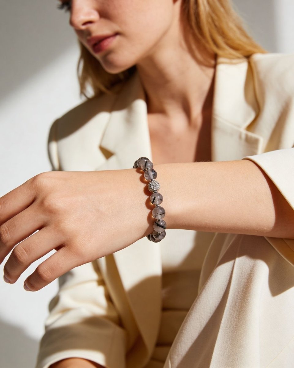 Woman wearing a black obsidian beaded bracelet for protection