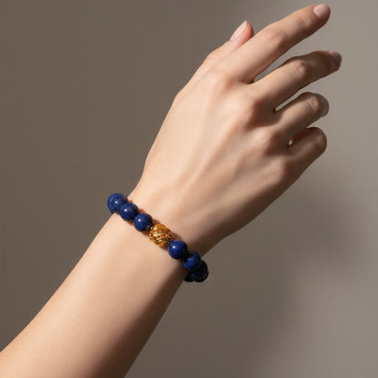 Golden Lucky Lapis Bracelet – 0.39-inch (10mm) deep-blue Lapis Lazuli beads with 14k gold-plated transformation bead, symbol of wisdom and good fortune by JWPatronus