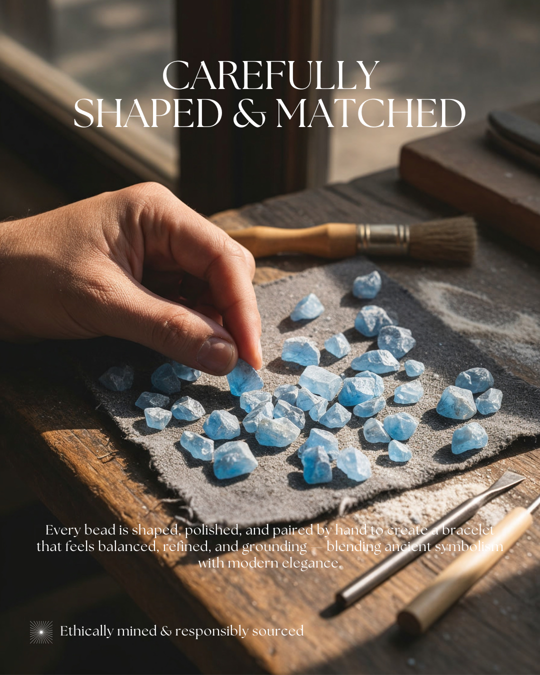 Artisan sorting raw aquamarine stones on workbench, handcrafted process for aquamarine beaded bracelet