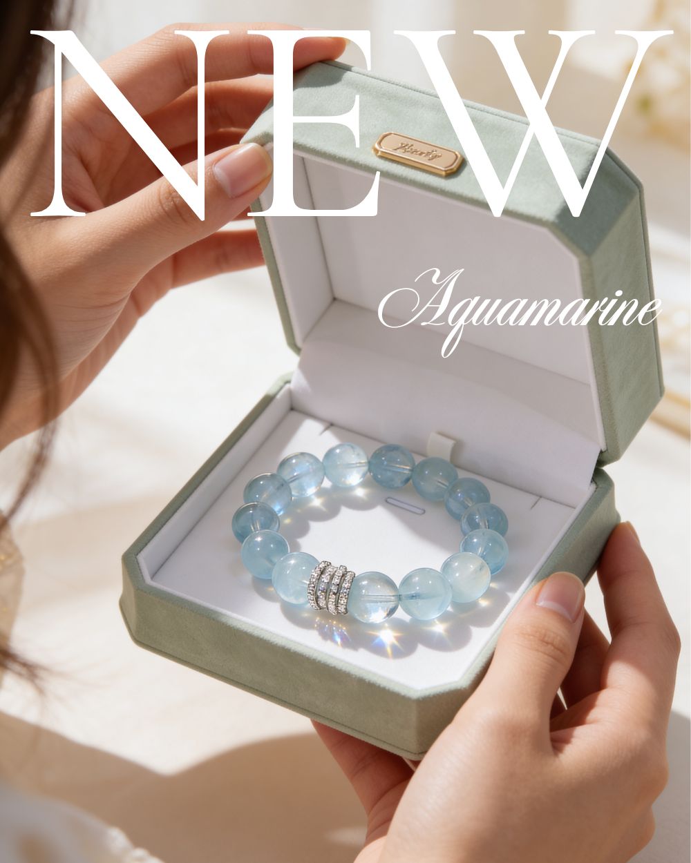 Gift-ready Ocean Calm Aquamarine beaded bracelet in an open jewelry box held in a woman’s hands
