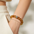 Gold citrine bracelet for women with 12mm beads worn in soft natural light