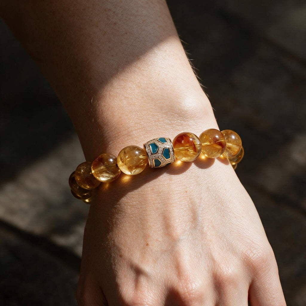 Amber Glow natural citrine bracelet worn on a woman’s wrist in warm sunlight and soft shadow.