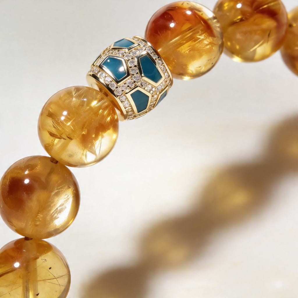 Close-up of natural citrine beaded bracelet with Green Agate centerpiece and gold-tone detail
