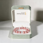 Aurora Bloom Strawberry Quartz bracelet presented in a JWPatronus keepsake gift box.