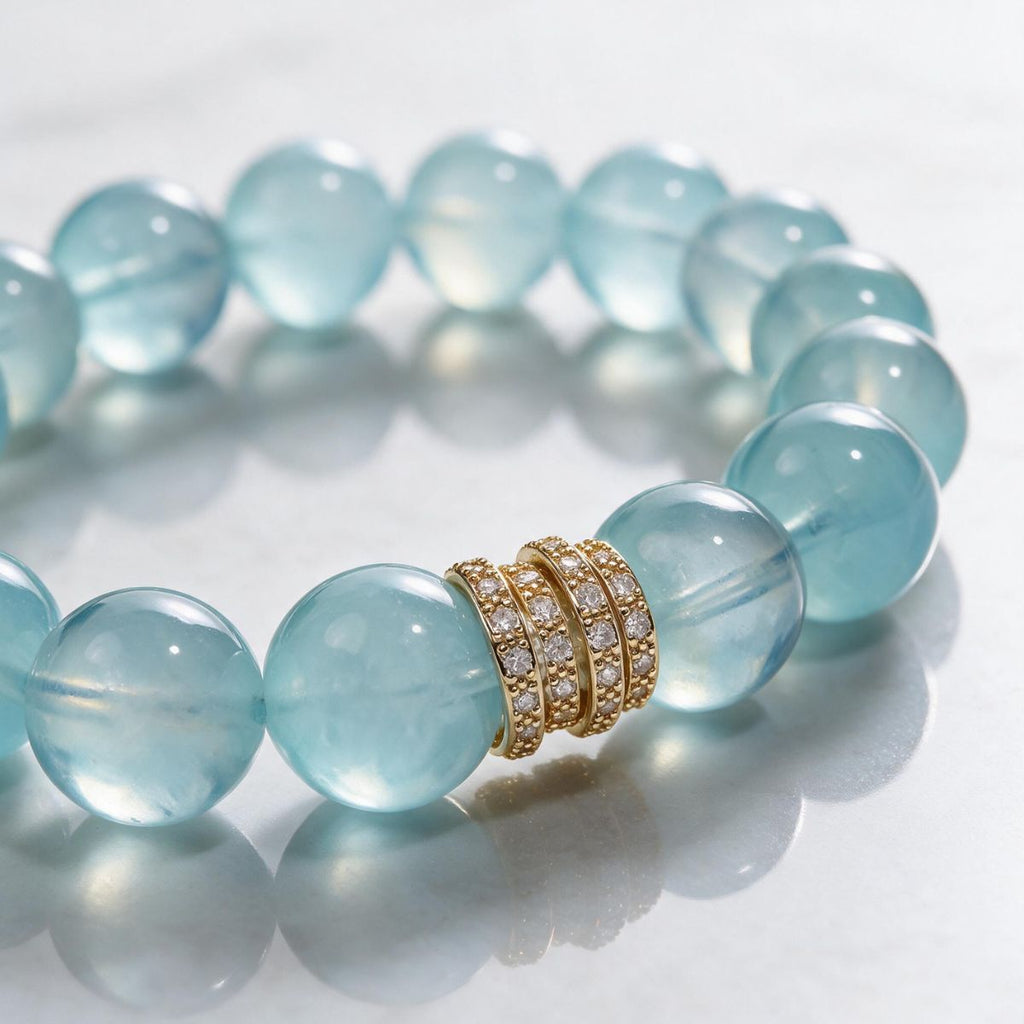 Close-up of the Gold Pavé Stack centerpiece and hand-polished natural aquamarine beads