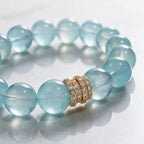 Close-up of the Gold Pavé Stack centerpiece and hand-polished natural aquamarine beads