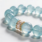 Close-up of the Gold Baguette centerpiece and natural aquamarine beads on the Blue Horizon bracelet