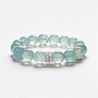 Blue Horizon natural aquamarine bracelet with 12mm ocean-blue beads and a Silver Halo centerpiece