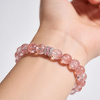 Woman wearing Blush Harmony Strawberry Quartz Beaded Bracelet with soft rosy-pink 10mm beads