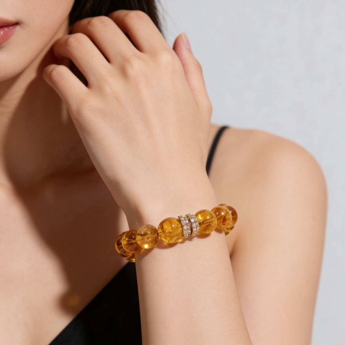 Citrine bracelet for women worn with elegant outfit and warm golden gemstone beads