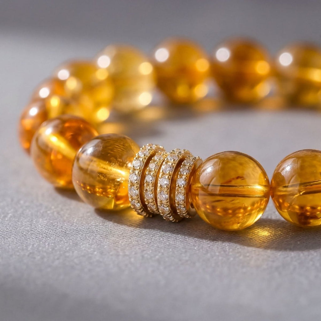 Citrine beaded bracelet close-up with golden 12mm beads and pavé barrel centerpiece