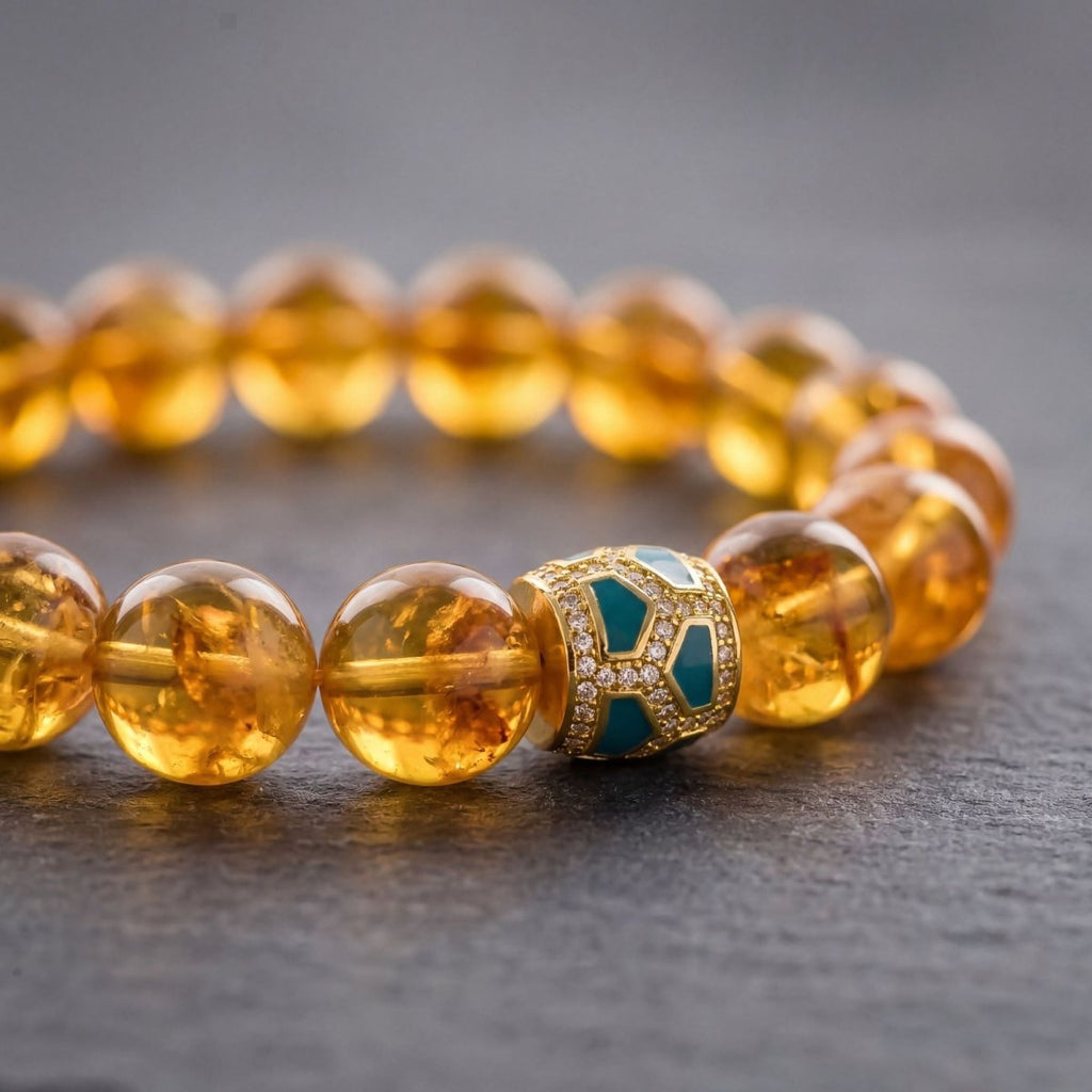 Close-up of Brazilian Citrine bracelet with Mosaic Green Inlay centerpiece and golden beads