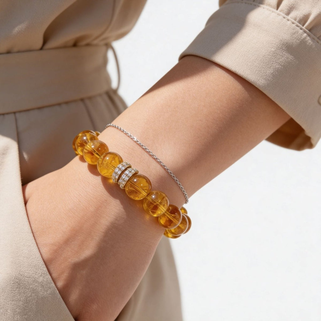 Brazilian Citrine bracelet worn on wrist with golden 12mm beads and pavé centerpiece