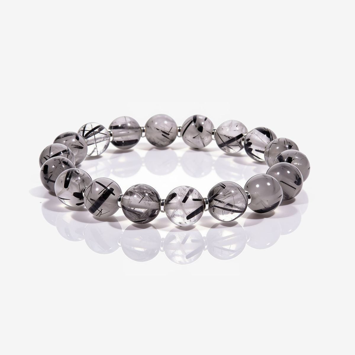 Calm Armor Black Rutilated Quartz Bracelet with 10.4mm hand-polished beads, natural black rutile inclusions, and polished metal spacers.