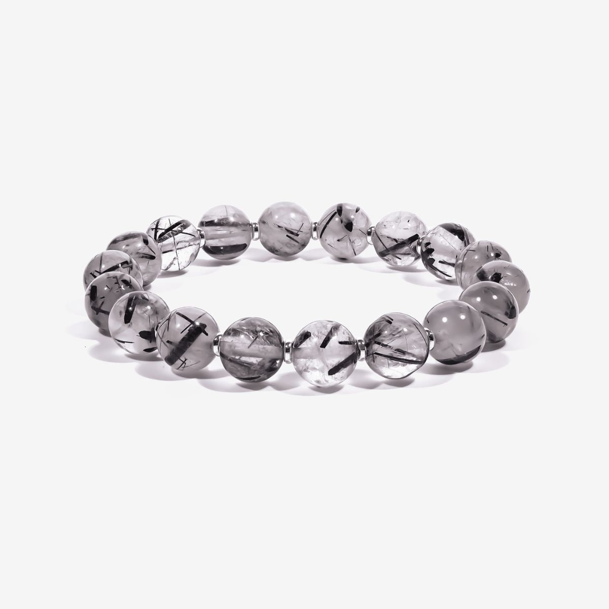 Calm Armor Black Rutilated Quartz Bracelet made with natural 10.4mm black rutilated quartz beads and polished metal spacers on a white background.