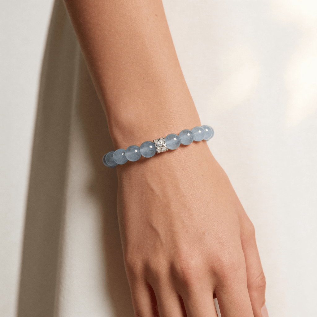 Blue aquamarine beaded bracelet worn on wrist in minimal lifestyle setting
