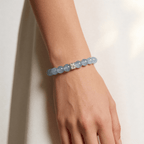 Blue aquamarine beaded bracelet worn on wrist in minimal lifestyle setting