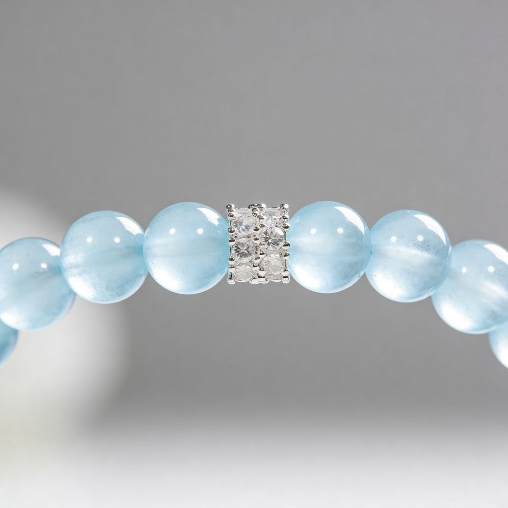 Close-up of aquamarine beaded bracelet with blue natural stone beads and cubic zirconia detail