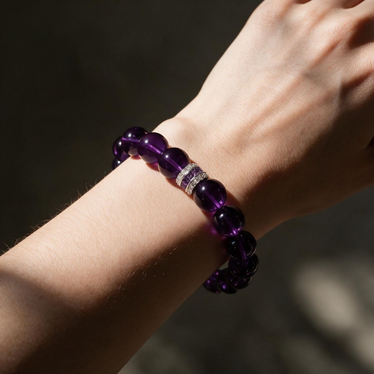Eternal Elegance natural Amethyst bracelet worn on a woman’s wrist in soft directional light.