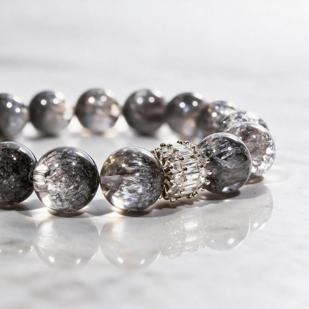 Close-up of natural Silver Phantom Quartz beads showing silver-gray tones, translucency, and natural inclusions