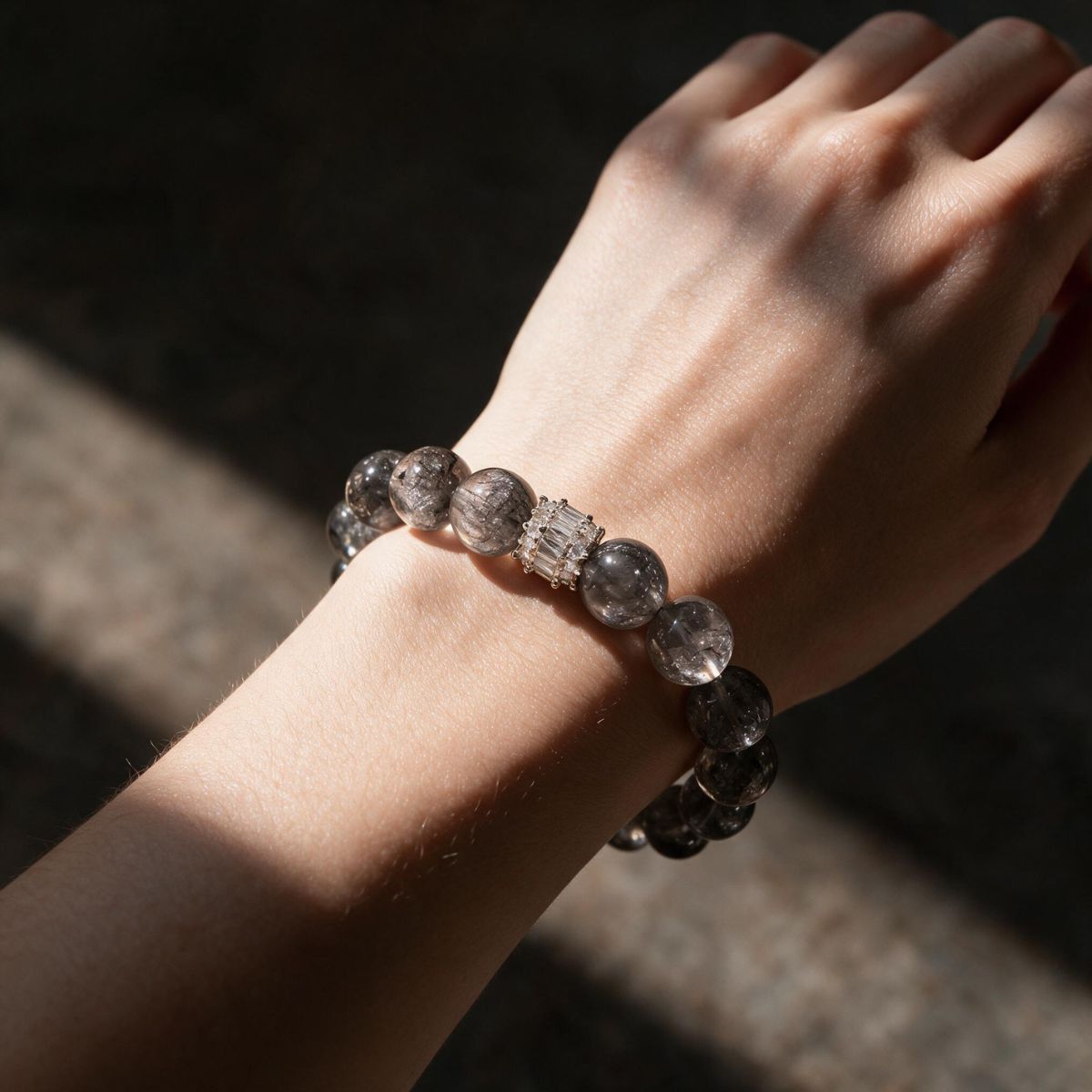 Ethereal Harmony Silver Phantom Quartz bracelet worn on the wrist with a refined neutral look