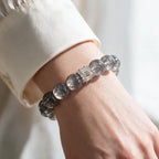 Natural Silver Phantom Quartz bracelet styled on the wrist with a clean white sleeve
