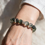 Forest Veil bracelet styled on the wrist with a white sleeve in bright natural light