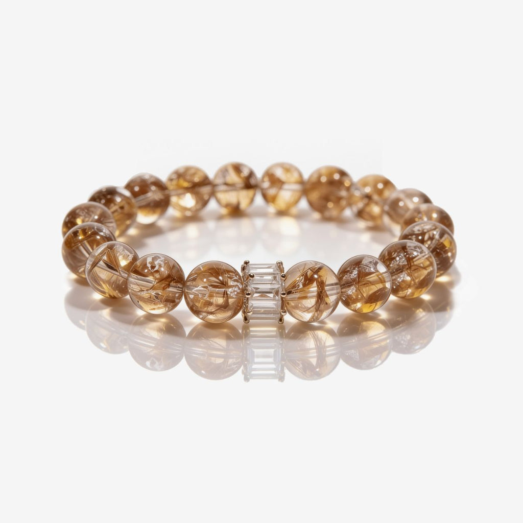 Natural Tanzanian Hematoid Quartz bracelet with 10.4mm beads and baguette crystal bar accent.
