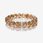 Natural Tanzanian Hematoid Quartz bracelet with 10.4mm beads and baguette crystal bar accent.