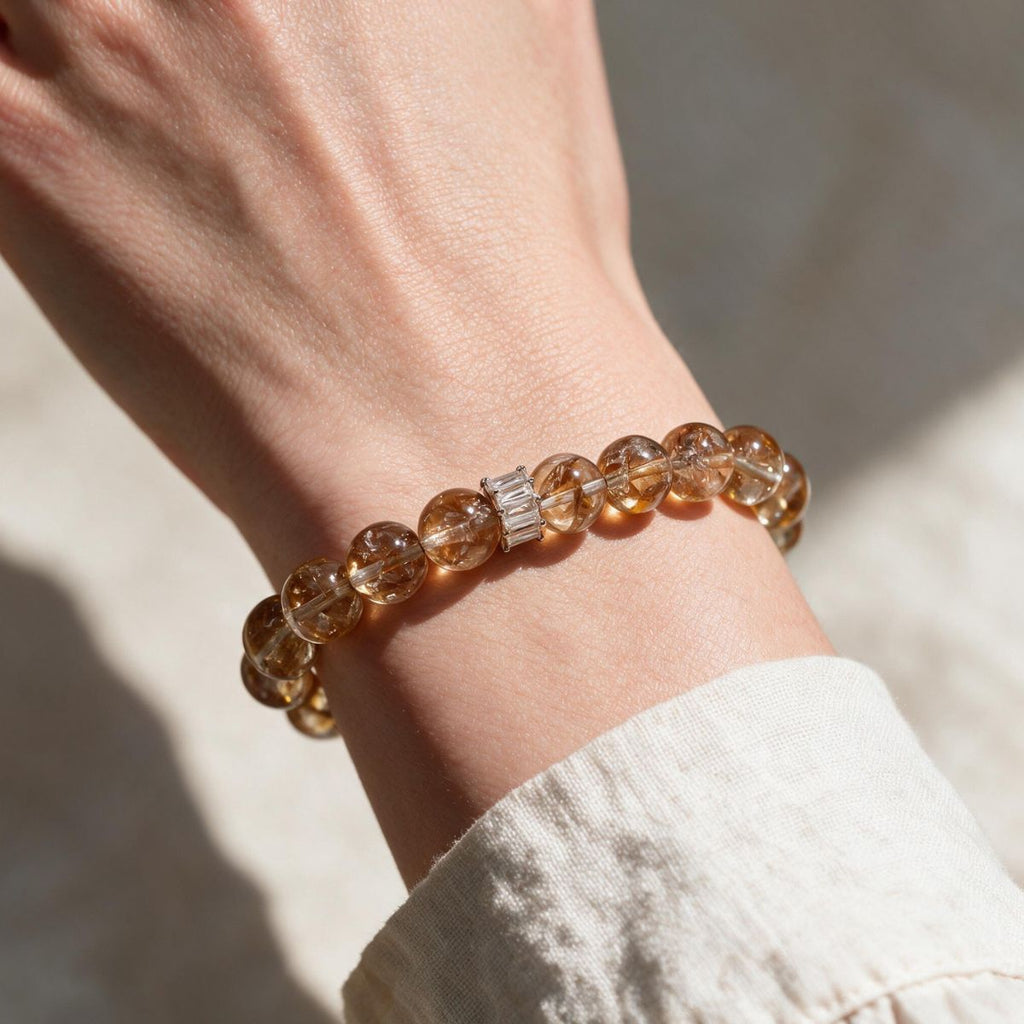 Golden-red Hematoid Quartz bracelet styled with a light neutral sleeve for polished everyday wear