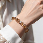 Fortune Koi Hematoid Quartz bracelet styled with a white shirt for a refined everyday look