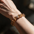 Fortune Koi Fire Quartz bracelet worn on the wrist in soft natural light