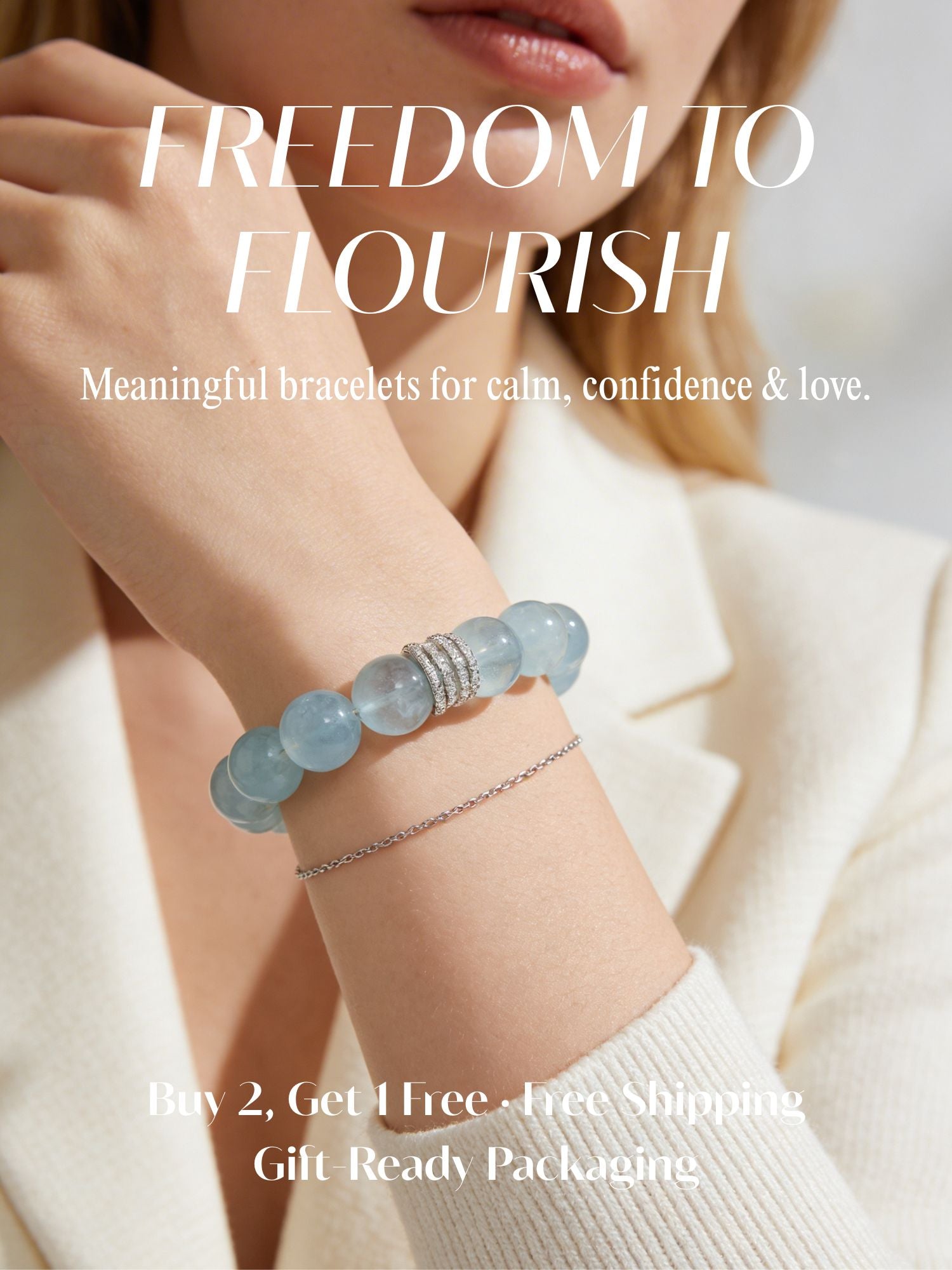 Freedom to Flourish July Crystal Event banner featuring a model wearing a natural aquamarine bracelet, with Buy 2, Get 1 Free, free shipping, and gift-ready packaging.