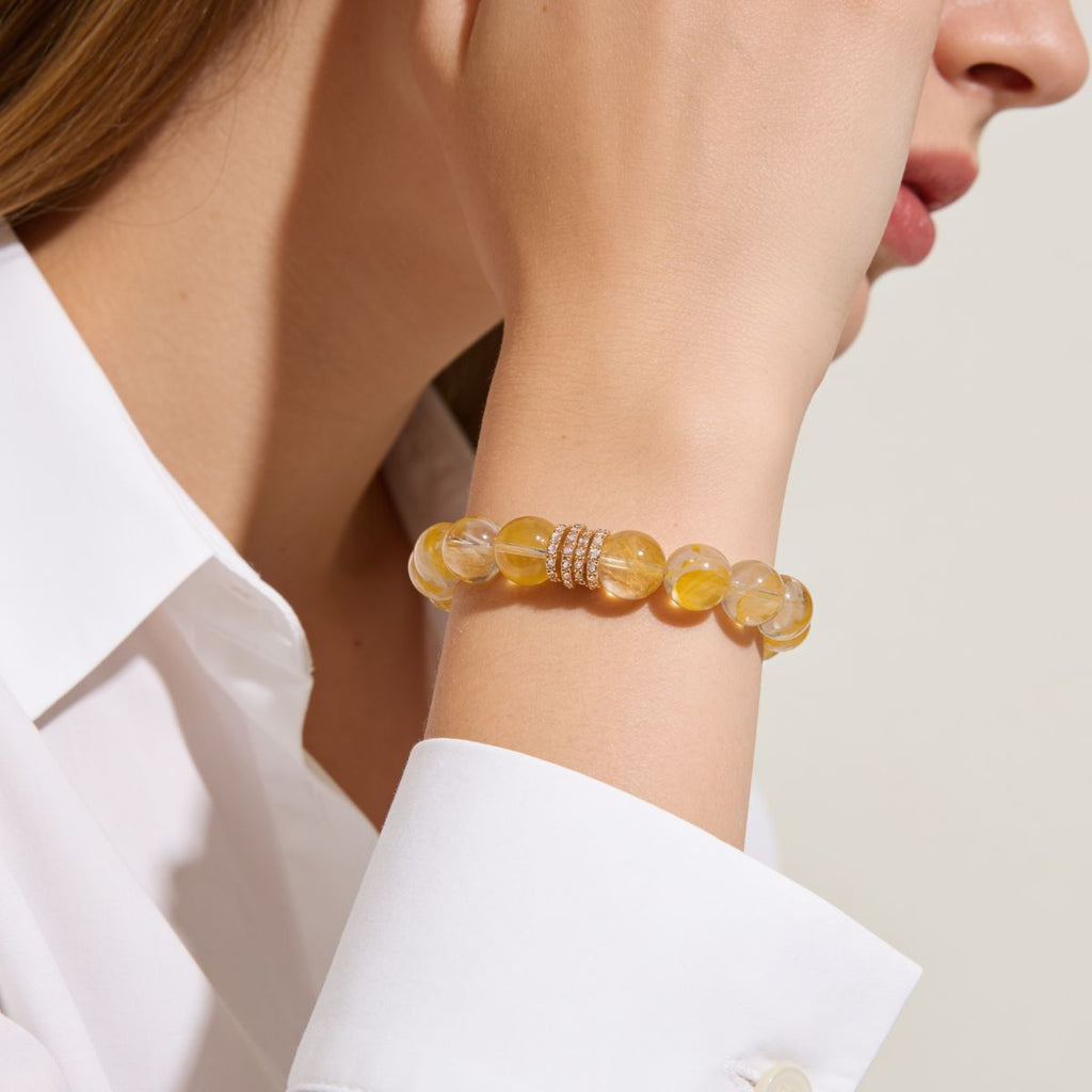 Golden Blossom Yellow Quartz Beaded Bracelet styled on a woman’s wrist with a clean feminine lifestyle look