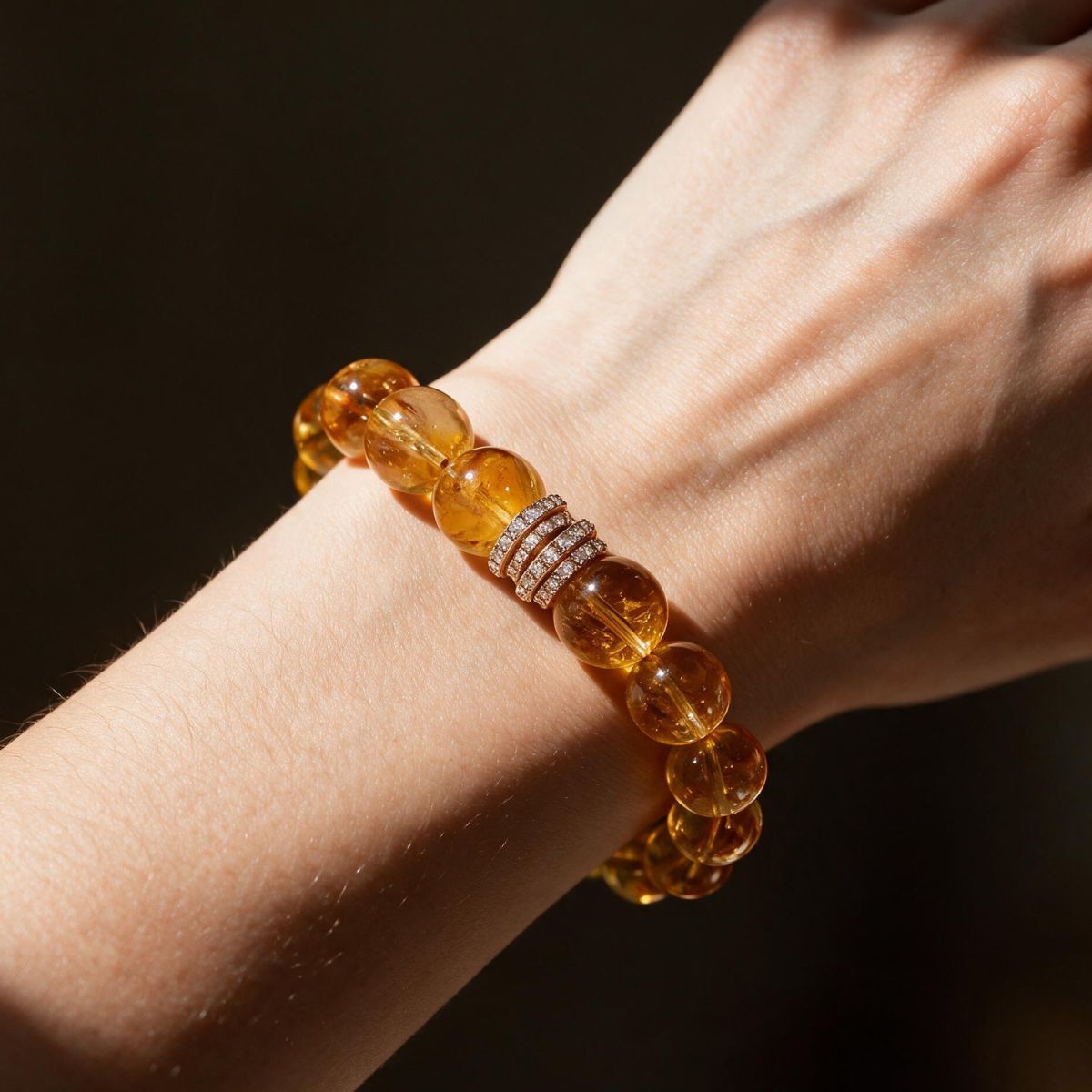 Golden Signature Brazilian Citrine Bracelet with Gold Pavé Barrel worn on a woman’s wrist