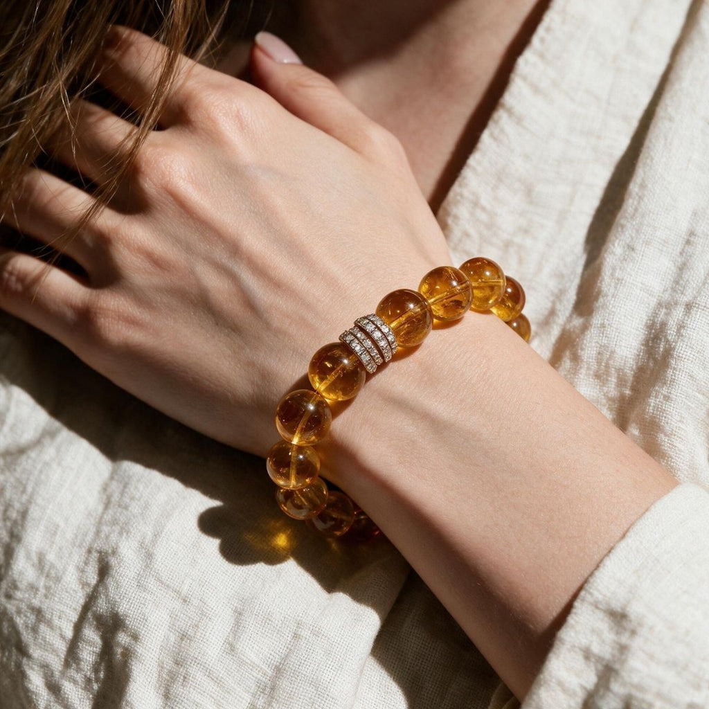Golden Signature Brazilian Citrine Bracelet with Gold Pavé Barrel centerpiece worn on a woman's wrist in natural light.