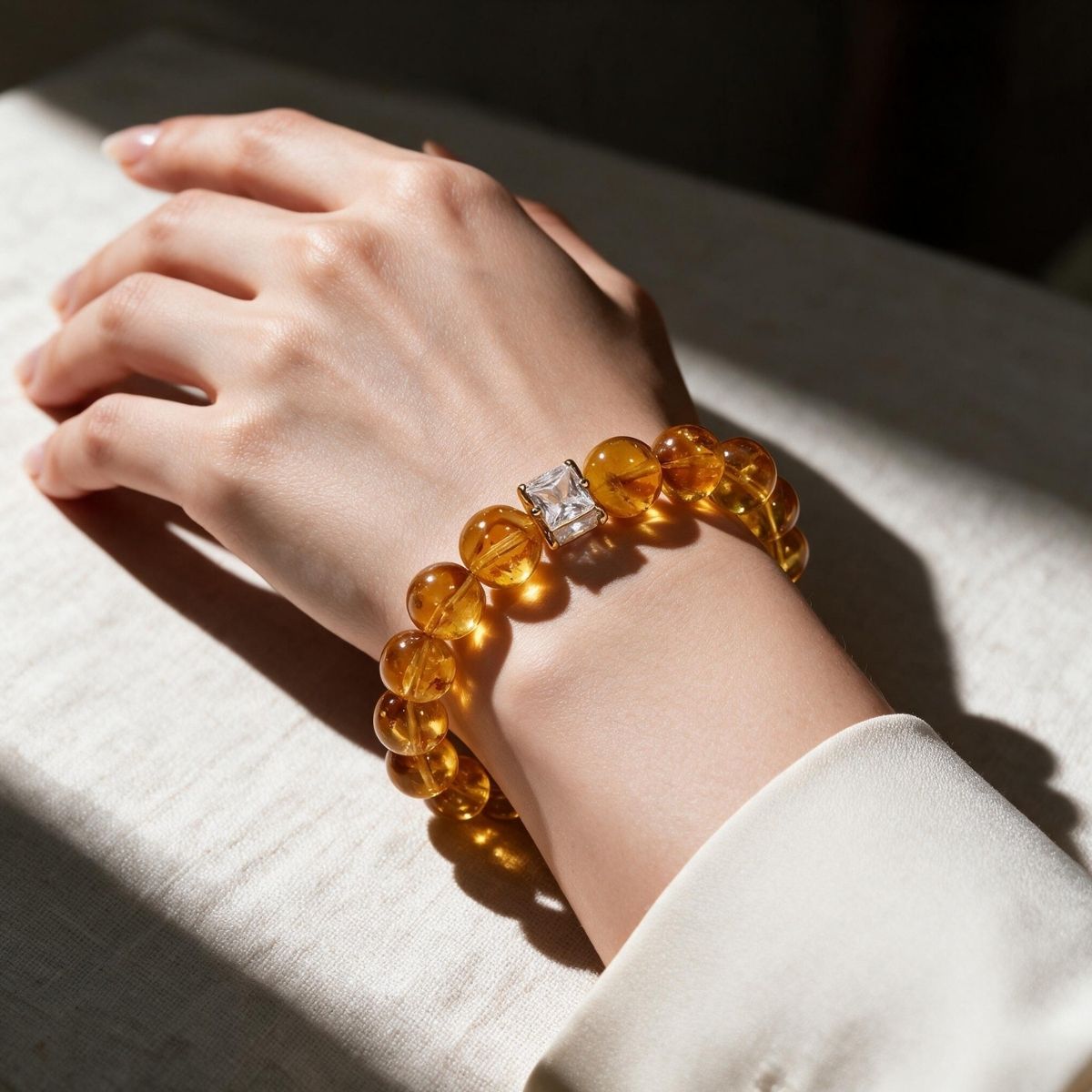 Golden Signature Brazilian Citrine Bracelet with Mosaic Green Inlay centerpiece worn on a woman's wrist.