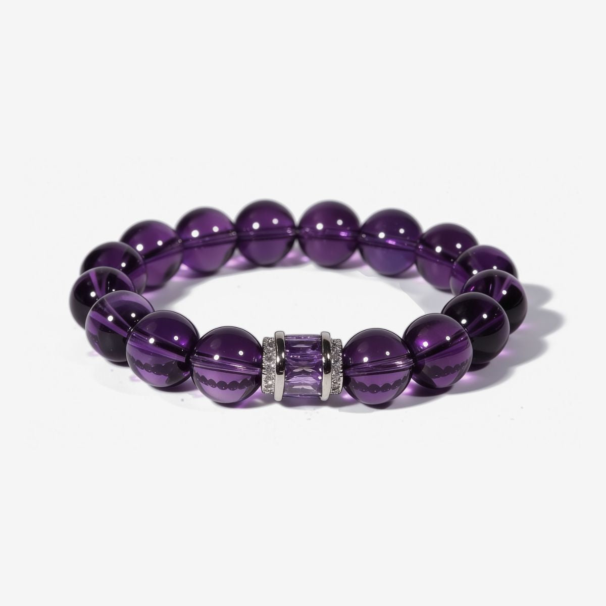 Graceful Amethyst Poise Bracelet with 10mm natural Sri Lankan amethyst beads and sterling silver centerpiece with faceted amethyst inlay