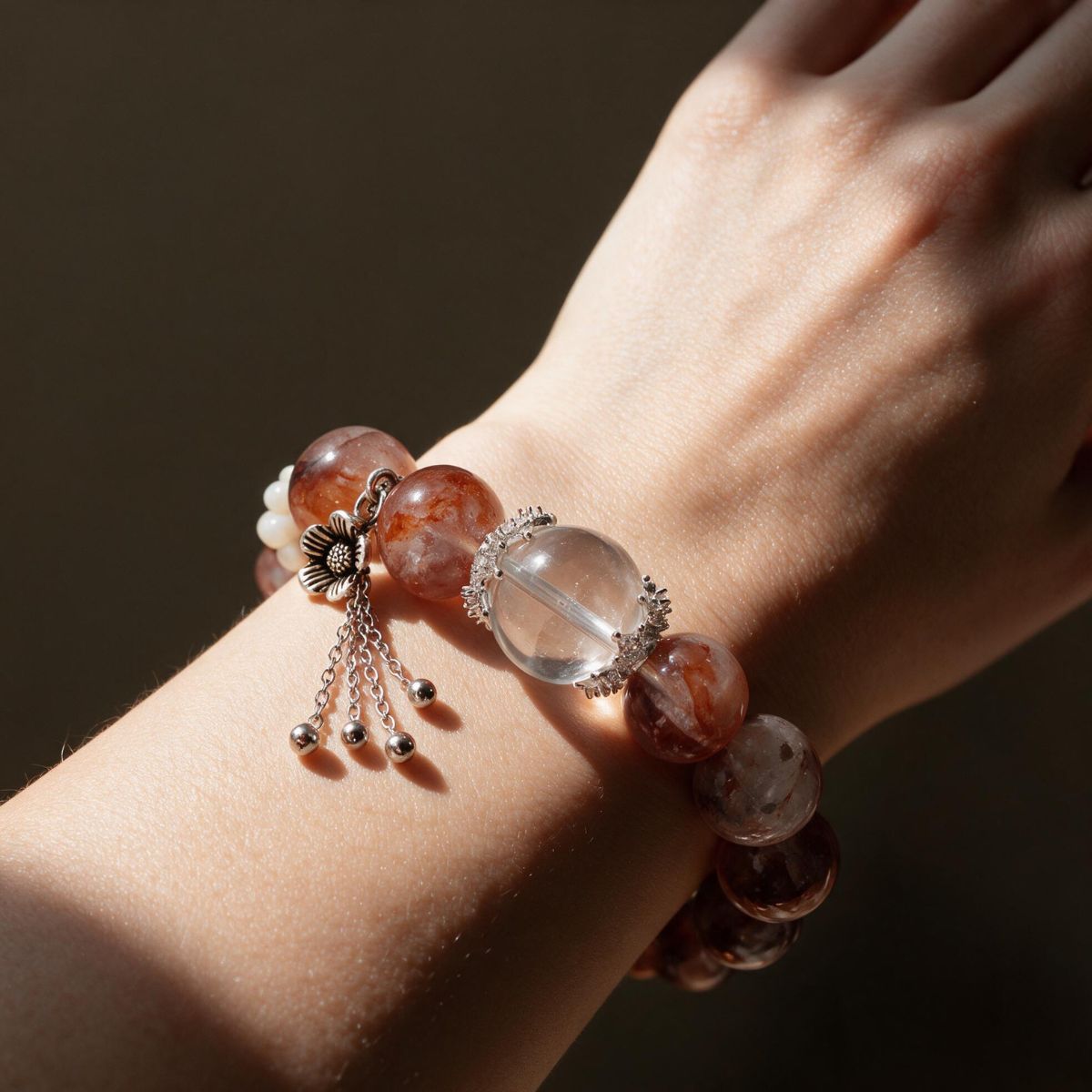 Hematoid Quartz Serenity bracelet worn on the wrist with statement 12mm Fire Quartz beads