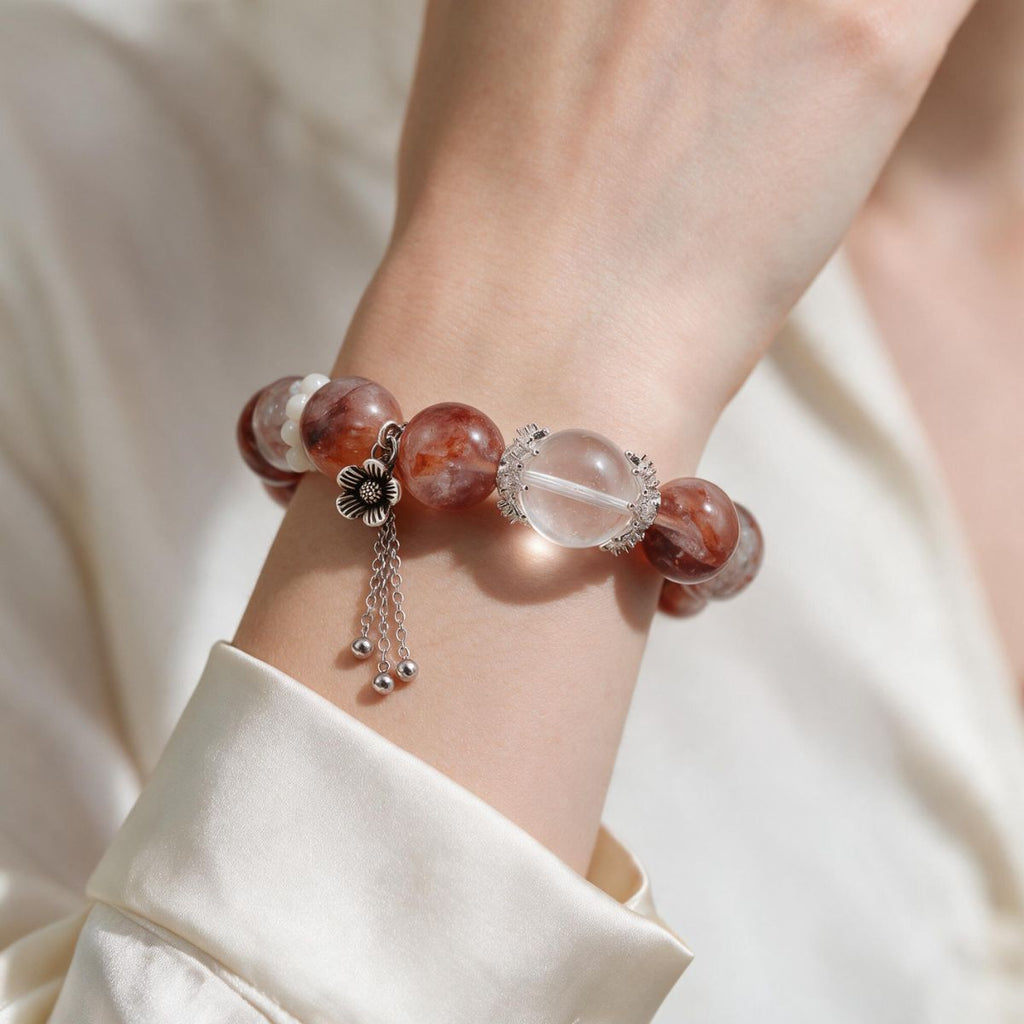 Natural Fire Quartz bracelet styled on the wrist with a soft white everyday look
