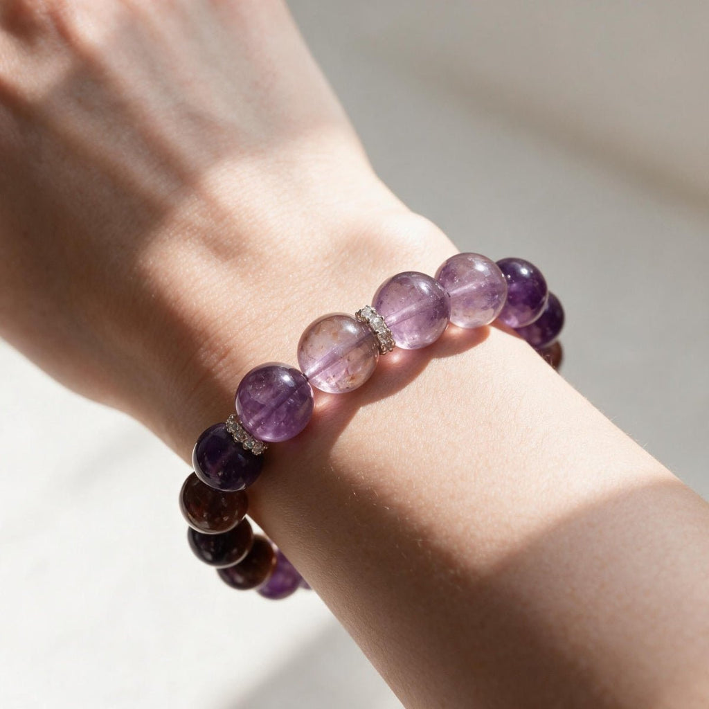 Woman wearing the Lunar Grace amethyst and lepidolite bracelet with 0.47 in (12mm) purple gemstone beads