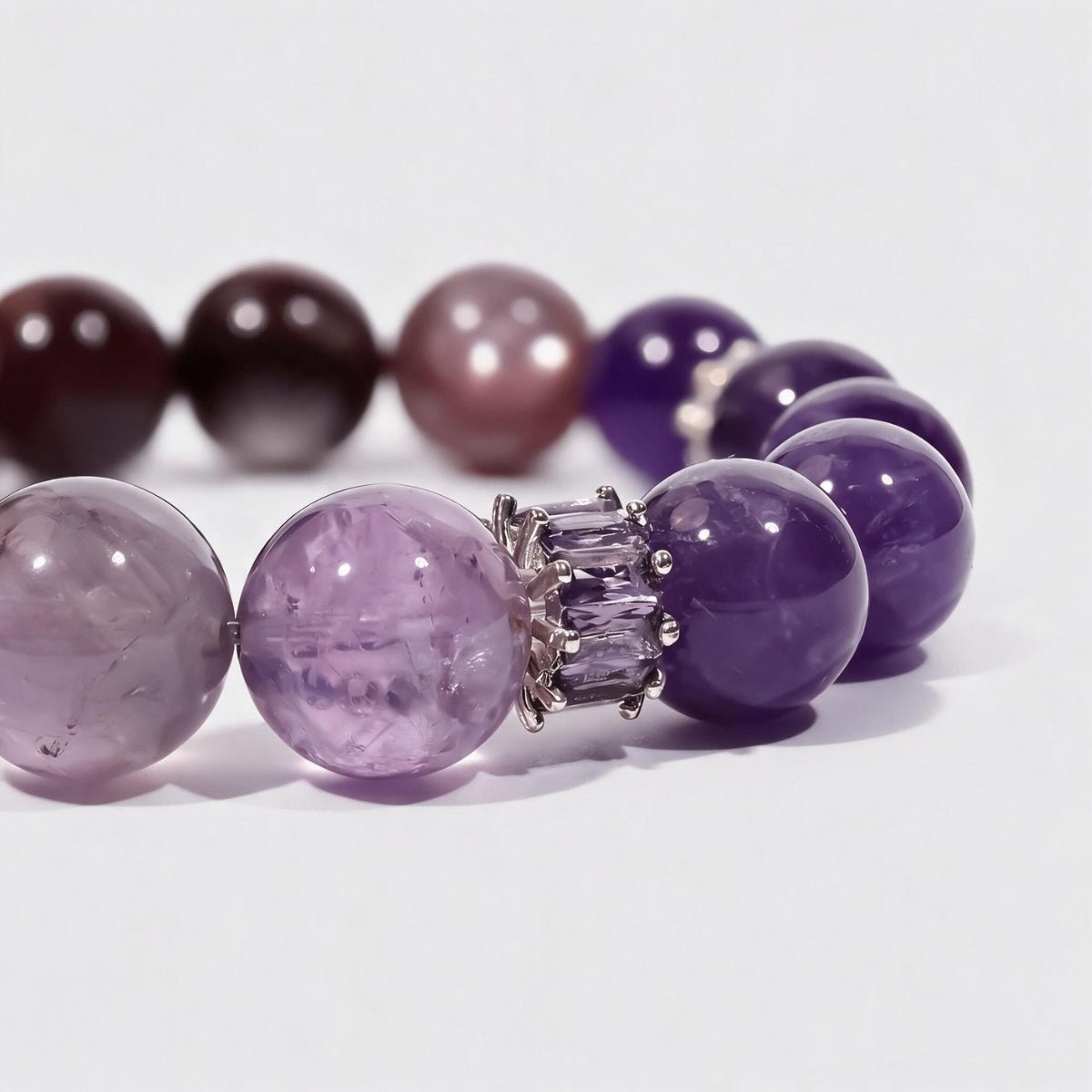 Close-up of the Lunar Grace bracelet’s lilac and mauve gemstone beads and sterling silver moon charm