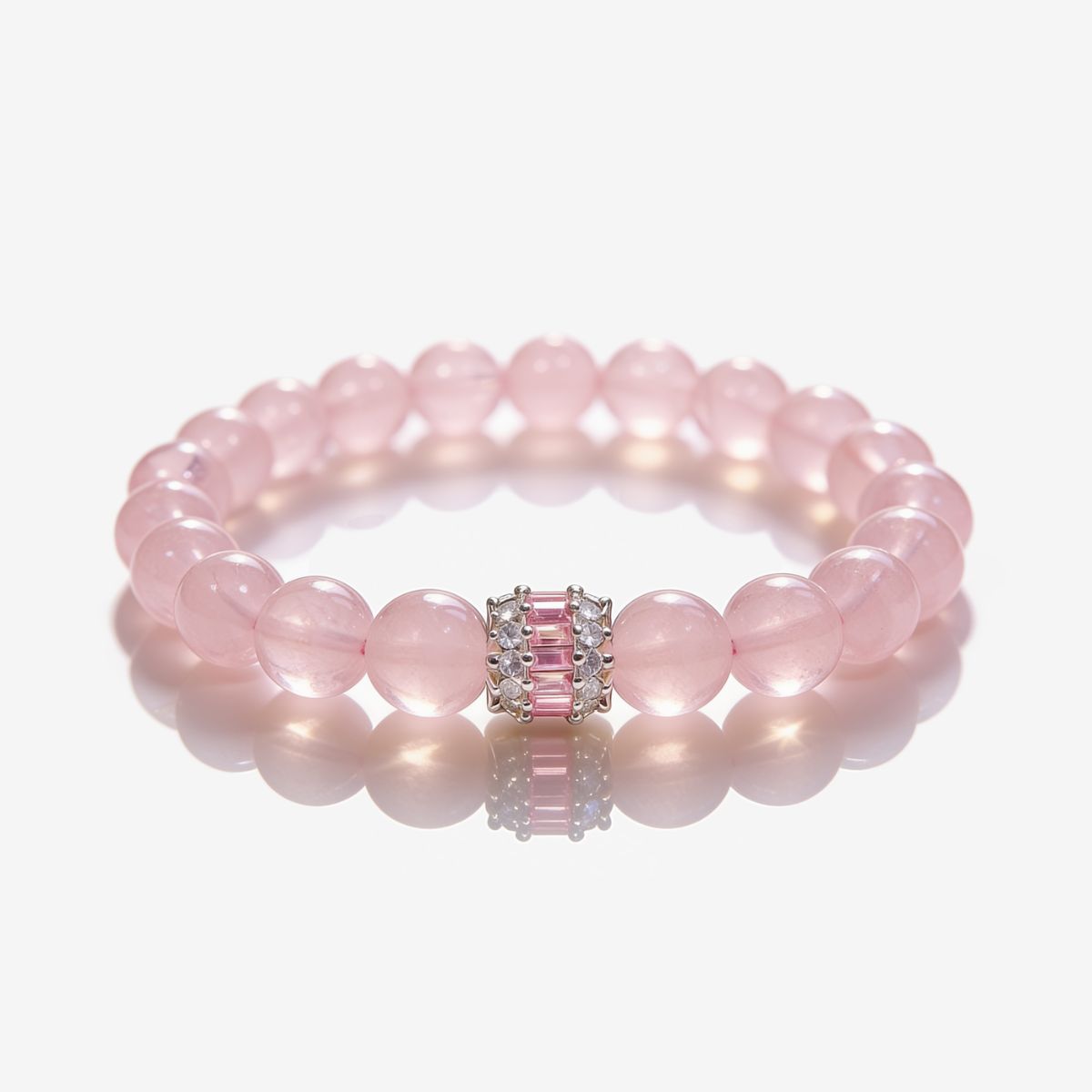 Madagascar Rose Quartz beaded bracelet with 10mm blush-pink beads and silver-tone pink baguette centerpiece