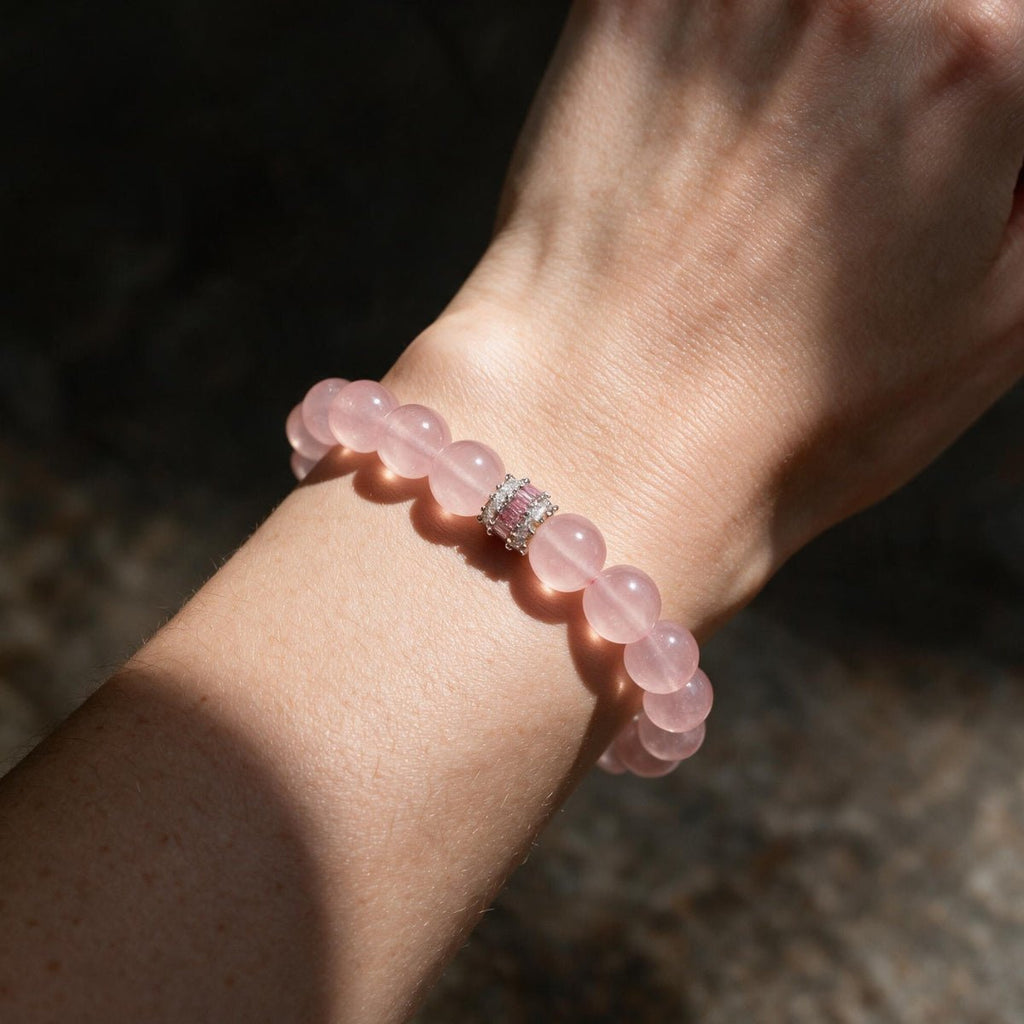 Natural Rose Quartz bracelet showing its soft pink translucency in direct sunlight
