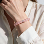 Madagascar Rose Quartz bracelet styled with a cream blouse for a polished everyday look