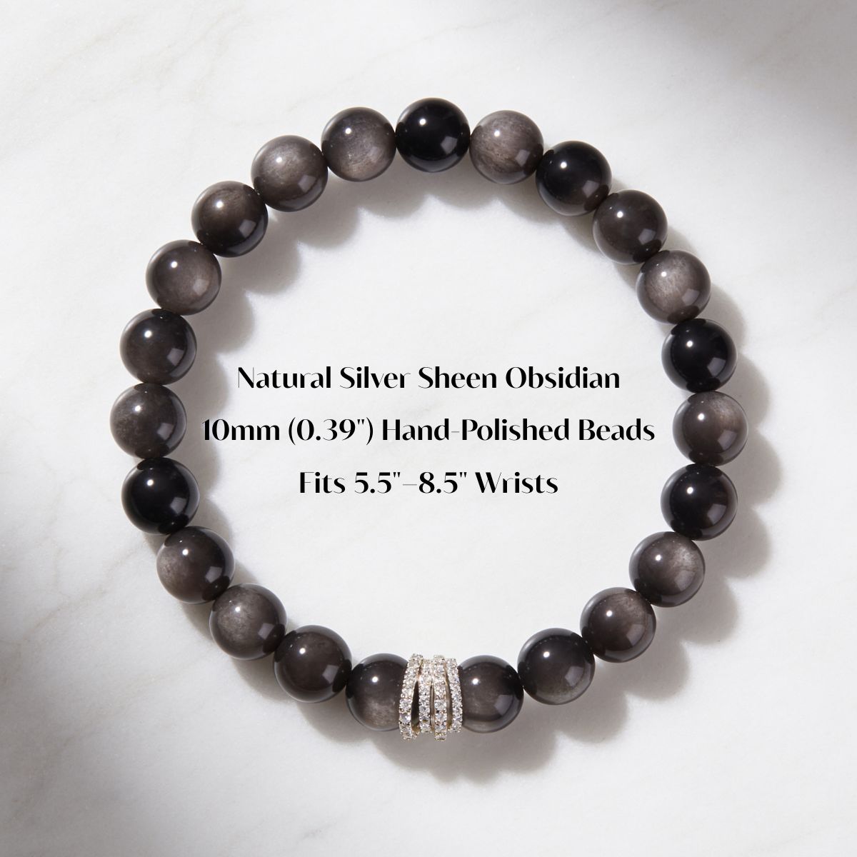 Midnight Shield bracelet details showing natural Silver Sheen Obsidian, 10mm beads, and XS–XXL sizing.