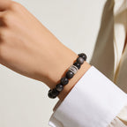 Midnight Shield Silver Sheen Obsidian Beaded Bracelet styled with a white shirt for a modern feminine look