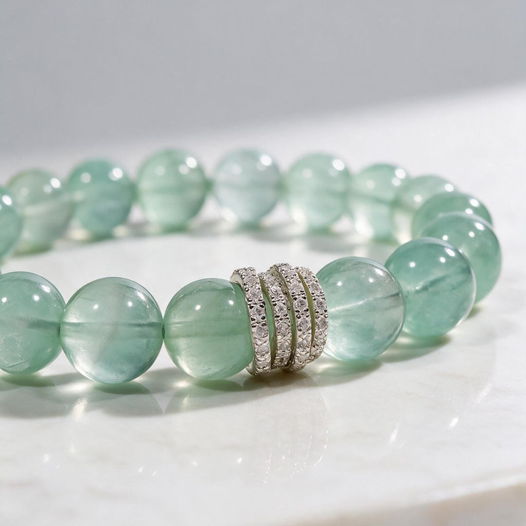 Close-up of natural Green Fluorite beads showing soft mint-green color and natural translucency
